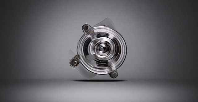 How does the design of a permanent magnet motor differ from an induction motor ?